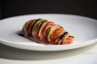 a plate with a colorful pasta on it