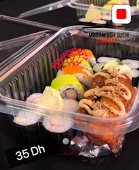 a tray of sushi in a plastic container